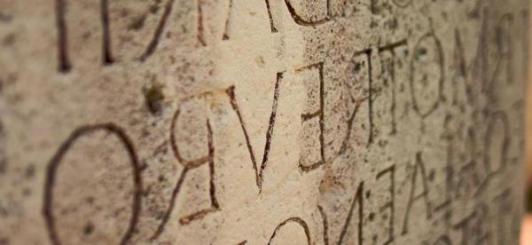 Latin phrases carved into stone